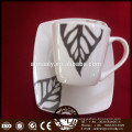 white ceramic tea cup and saucer set